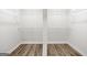 Walk-in closet with wire shelving and wood flooring for organized storage at 3219 Broadnax Mill Rd # 5, Loganville, GA 30052