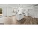 Modern kitchen with an island, subway tile backsplash, and stainless appliances at 3219 Broadnax Mill Rd # 5, Loganville, GA 30052