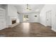 Open-concept living room with a fireplace, built-in shelving, and a doorway at 3219 Broadnax Mill Rd # 5, Loganville, GA 30052
