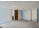 A carpeted bedroom featuring natural light, built-in shelving, and closet, ideal for relaxation and organization at 5493 Alexanders Lake Sw Rd, Stockbridge, GA 30281