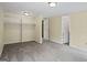 Open and spacious bedroom with closet and a doorway to another room at 5493 Alexanders Lake Sw Rd, Stockbridge, GA 30281