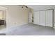 Spacious bedroom with ensuite bathroom, ceiling fan, and ample closet space at 5493 Alexanders Lake Sw Rd, Stockbridge, GA 30281
