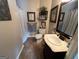 Cozy bathroom with decorative elements, framed art, and essential fixtures at 332 Wyngate Rd, Auburn, GA 30011
