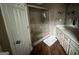 Bathroom featuring a glass shower and a neutral-toned vanity at 332 Wyngate Rd, Auburn, GA 30011
