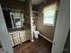 Neutral bathroom features a toilet, single sink vanity, and wood-look floors at 332 Wyngate Rd, Auburn, GA 30011