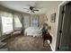 Cozy bedroom featuring natural light, ceiling fan, and comfortable furnishings at 332 Wyngate Rd, Auburn, GA 30011