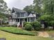 Charming two-story home featuring a welcoming porch and beautifully landscaped front yard at 332 Wyngate Rd, Auburn, GA 30011