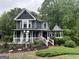 Charming two-story home featuring a welcoming porch and beautiful front yard landscaping at 332 Wyngate Rd, Auburn, GA 30011