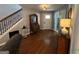 Welcoming foyer with hardwood floors and staircase, offering a glimpse of the home's interior at 332 Wyngate Rd, Auburn, GA 30011