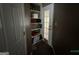Hallway with convenient built-in shelves, perfect for storage or displaying decor at 332 Wyngate Rd, Auburn, GA 30011