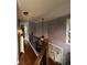 Open hallway with hardwood floors leading to bedrooms and featuring natural light at 332 Wyngate Rd, Auburn, GA 30011