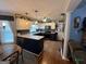 Well-lit kitchen with white cabinets and navy blue lower cabinets, and modern appliances at 332 Wyngate Rd, Auburn, GA 30011