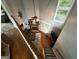 View of the living room with a cozy fireplace and staircase at 332 Wyngate Rd, Auburn, GA 30011