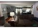 Open concept living room with modern décor, dining area, and adjacent kitchen at 332 Wyngate Rd, Auburn, GA 30011