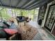 Relaxing screened porch furnished with seating, perfect for enjoying outdoor living at 332 Wyngate Rd, Auburn, GA 30011