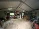 Well lit interior of a workshop containing work benches, tools and plenty of storage at 332 Wyngate Rd, Auburn, GA 30011