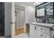 Updated bathroom with granite countertop vanity and white cabinets featuring an updated faucet and fixture at 1858 Ridgeland Dr, Decatur, GA 30032