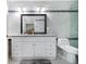 Bright bathroom with a granite vanity, tile backsplash, and modern fixtures at 1858 Ridgeland Dr, Decatur, GA 30032