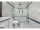Modern bathroom with a glass-enclosed shower, stylish tile work, and a rainfall shower head at 1858 Ridgeland Dr, Decatur, GA 30032