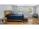 Bedroom featuring hardwood floors, natural light, and a comfortable bed at 1858 Ridgeland Dr, Decatur, GA 30032