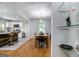 Open-concept dining area featuring hardwood floors and view of modern kitchen at 1858 Ridgeland Dr, Decatur, GA 30032