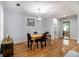 Bright dining room with hardwood floors, a modern chandelier, and seating for four at 1858 Ridgeland Dr, Decatur, GA 30032