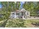 A quaint one-story home boasts a well-manicured lawn and charming front entrance at 1858 Ridgeland Dr, Decatur, GA 30032