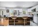 Stylish kitchen island with seating, granite countertops, stainless appliances, and bright natural light at 1858 Ridgeland Dr, Decatur, GA 30032