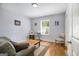 Relaxing living room with a comfortable sofa, natural light, and hardwood floors at 1858 Ridgeland Dr, Decatur, GA 30032