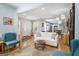 An open-concept living space features hardwood floors and a glimpse into the kitchen at 1858 Ridgeland Dr, Decatur, GA 30032