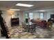 Finished basement with tile floors, a seating area, and a dining table at 160 Hialeah Way, Roswell, GA 30075