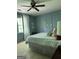 Comfortable bedroom features a ceiling fan, neutral carpet, and coordinating blue wall color at 160 Hialeah Way, Roswell, GA 30075