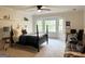 Bedroom with great natural light, a ceiling fan, and an adjacent desk area for work at 160 Hialeah Way, Roswell, GA 30075
