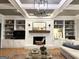 Cozy living room features a brick fireplace, coffered ceiling, and built-in bookshelves at 160 Hialeah Way, Roswell, GA 30075