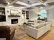 Bright living room with coffered ceiling, brick fireplace, and comfortable seating at 160 Hialeah Way, Roswell, GA 30075