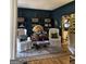 Cozy room featuring built-in shelves, hardwood floors and plush seating at 160 Hialeah Way, Roswell, GA 30075