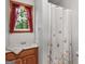 Updated bathroom featuring butterfly shower curtain, and a modern vanity at 930 Singley Dr, Locust Grove, GA 30248