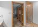 View through doorway of a shower with glass doors, and beige tiled walls at 930 Singley Dr, Locust Grove, GA 30248