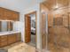 A view from the bathroom of the shower with glass doors, and bedroom beyond at 930 Singley Dr, Locust Grove, GA 30248