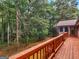 View from deck looking at wooded yard and side of house at 930 Singley Dr, Locust Grove, GA 30248