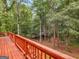 View from deck looking out to lush green trees and an outbuilding at 930 Singley Dr, Locust Grove, GA 30248