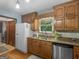 Well-appointed kitchen featuring wood cabinets, granite countertops, and stainless steel appliances at 930 Singley Dr, Locust Grove, GA 30248