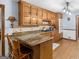 Well-equipped kitchen features granite countertops, custom cabinetry, and a convenient breakfast bar at 930 Singley Dr, Locust Grove, GA 30248