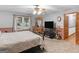 Neutral main bedroom with a ceiling fan, plush carpet, and lots of space at 930 Singley Dr, Locust Grove, GA 30248