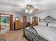 Neutral main bedroom with a ceiling fan, plush carpet and attached bath at 930 Singley Dr, Locust Grove, GA 30248