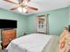 Cozy main bedroom with a ceiling fan, plush carpet and a bright window at 930 Singley Dr, Locust Grove, GA 30248