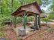 Outdoor picnic area featuring a wooden structure, picnic table, and swing set at 930 Singley Dr, Locust Grove, GA 30248