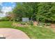 Landscaped backyard area featuring a charming garden shed and a small garden area at 105 Riviera Ct, Fayetteville, GA 30215