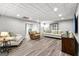Finished basement boasts stylish flooring and a comfortable seating area, with elegant decor and neutral tones at 105 Riviera Ct, Fayetteville, GA 30215