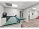 Finished basement with a wet bar featuring modern appliances, neutral walls, and durable floors at 105 Riviera Ct, Fayetteville, GA 30215